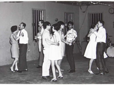 My father James with my mother Teresa dancing at the Sergeants mess at the far right of the photo. To the far left is Sergeant Green with his wife. They resided on Sussex estate too.
