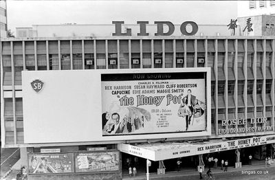 The Lido Cinema
The Lido Cinema at the junction of Orchard and Scotts Road. The present Lido, at the top of the atrium of another shopping centre, is reached by a number of vertiginous escalators - all made by Schindler, as I noticed when I came out of the auditorium with a hushed audience after seeing Schindler's List!
Keywords: Bill Johnston;The Lido Cinema;Orchard Road;Scotts Road
