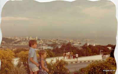 My brother and I looking over Singapore 1971
This was taken on top of Mt Faber.  In the background is Empire Dock at Keppel Road.  The Tanjong Pagar Railway Station is on the left of Empire Dock.
Keywords: Lucy Childs;Mt Faber;1971;Empire Dock;Keppel Road;Tanjong Pagar Railway Station