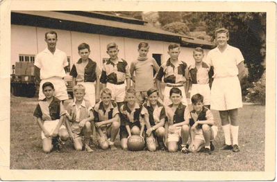 Changi Junior School Football Team 1958-59
Thanks to Martin Woodward for this photo of Changi Junior school football team of 1958/59.  Martin said - I am third from the left of the photo at the back standing I can only recall the name of the head teacher Mr Roberts who is standing on the far right of the photo I was aged 13 at the time.
My father Jack Woodward was a flight Sergeant in the RAF at that time and I lived with my mother Isobel in Manston Road Changi 
Keywords: Martin Woodward;Changi;Junior Football;1958;Manston Road