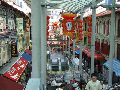 Pagoda Street China Town
Pagoda Street China Town, this structure has been built over the original street and forms part of a bridge running over the main road alongside.  The escalators go down directly to China Town MRT station
Keywords: Pagoda Street;China Town;MRT;2006
