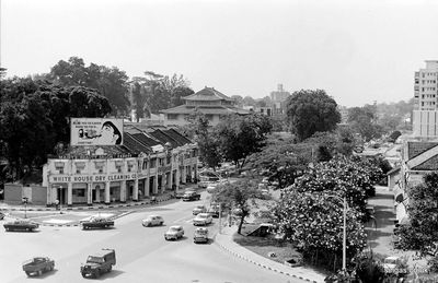 Looking down Orchard Road towards CK Tang
Looking down Orchard Road towards CK Tang (on the left), taken from Liat Towers, the stubby block which housed Donald Moore Galleries after it moved from its original premises in Clemenceau Avenue. It's amazing that there are no high-rise buildings along the length of this part of Orchard Road; compare it with today! Orchard Road was two-way traffic in the 1960s, something present-day Singapore children find hard to believe - as, also, that policemen wore short trousers then!
Keywords: Bill Johnston;Orchard Road;CK Tang;Liat Towers;Donald Moore Galleries;1967