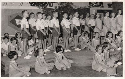 school concert at the RN School
I think this school concert at the RN School was in 1965.

I am standing third from the right, the girl next to me was Julia Buckle, and the girl on the far right was Susan Jewel.

The boy standing in the middle of the picture, holding a book I think  is Richard Middleton, who went on to win â€˜The Krypton Factorâ€™ on TV. I think the boy next to him was called Paul, and the boy to his left was Stephen Brown.
My thanks to Janet Laidlaw for this photo. 
Keywords: RN School;1965;Julia Buckle;Susan Jewel;Richard Middleton;Stephen Brown;Janet Laidlaw
