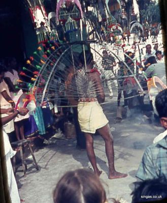 Thaipussam
Thaipussam, a Hindu festival of penance.  This guy is wearing a Kavardi, (a steel cage) complete with spikes that penetrate the body.
Keywords: Thaipussam;Hindu;Kavardi