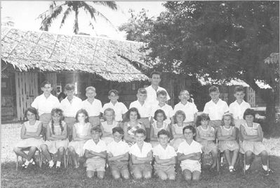 Changi Junior School 1966
Thanks to Andrew Barnes for this school photo taken in June 1966.  Andrew is 3rd from the right on the back row.  Andrew lived at 38a Sealand Road, and went onto Secondary School at R A F Seletar, before returning to the UK in May 1967.  Adrian Gallagher has identified himself as being on the back row first right.  Adrian lived at 16b Duxford Road.  Carol Elander informed me that her sister, Christine Spillane is the last pupil on the far right of the middle row.  They got posted to RAF Brize Norton after Singas.
Keywords: Changi Junior School;Andrew Barnes;1966;Adrian Gallagher;Christine Spillane
