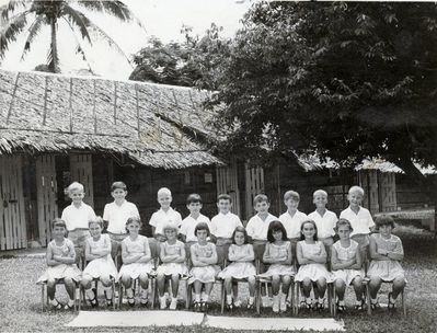 Changi Juniors 1964
My thanks to Wayne Killington, First right on the back row, whose father was with 41 squadron RNZAF.  He thinks this photo was taken in late 1966 and that he was in standard 4, and that he was in one of class rooms in the background of photo.  He was the only New Zealander in the class.

Julie Dunbar thinks that this is Class 2a1 outside what was their classroom. Julie is on the front row, second from right.  Her best friend, Winifred was 4th from left on the front row.
Keywords: Changi Juniors;1966;Wayne Killington;41 squadron;RNZAF;Julie Dunbar;1964