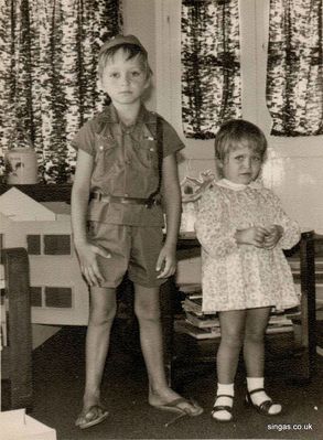 My brother and I on Boxing Day 1970
My brother and I on Boxing Day 1970 in the drawing room of our bungalow on the Kranji base.
Keywords: Lucy Childs;1970