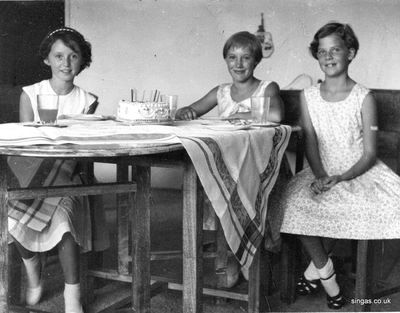 My 10th birthday
My 10th birthday (April 1959) at Pasir Panjang flats â€“ I am on the right but who are the other two girls?
Keywords: Susan Perry;Pasir Panjang flats;1959