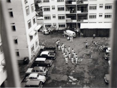 Taken from our 5th floor flat, Far East Mansions
Taken from our 5th floor flat, Far East Mansions, circa 1968.  I am not sure what the occasion is but that small marquee is set up right outside the flat that was used as the families club so would assume there was a do of some kind on, complete with marching band.
Keywords: Far East Mansions;1968