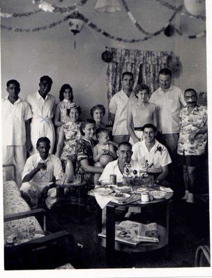 Christmas 1957 with friends (HM Naval Base)
229e St. Johnâ€™s Road. our family with friends and dads dockyard colleagues. 
