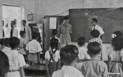 Telok Paku School 1951
My late father, Edwin Soh Chuan Lam, early in his teaching career at Telok Paku Primary School, was paid a visit by an officer from RAF Changi in 1951, the year it opened.  The school was closed to make way for the new Changi Airport.
