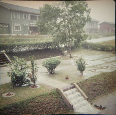 RAF Tengah Tour 1961-1964.
Outside 58 Meteor Road during monsoon rain.
