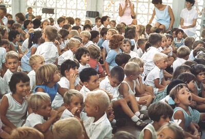 My sister Gill Moffett at Tengah Primary School when she about 7 years old. She is sitting next to the blonde girl with a blue top looking very intense. Looks like her whole year is present at assembly.
Keywords: Gillian Moffett;1967;Tengeh;Primary school