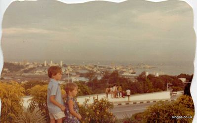 My brother and I looking over Singapore 1971
This was taken on top of Mt Faber.  In the background is Empire Dock at Keppel Road.  The Tanjong Pagar Railway Station is on the left of Empire Dock.
Keywords: Lucy Childs;Mt Faber;1971;Empire Dock;Keppel Road;Tanjong Pagar Railway Station