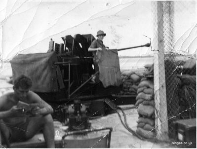 Anti aircraft gun on the beach at Seletar
My brother's friend 'Will' on the gun.
Keywords: Seletar;AA gun;Anti aircraft gun