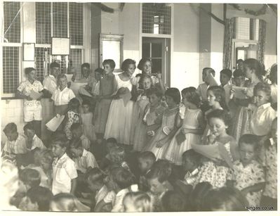 Carol singing at RAF Tengah
Carol singing at RAF Tengah, believe Christmas 1959. Not sure of the venue inside base
Keywords: Neil McCart;Carol singing;RAF Tengah;1959