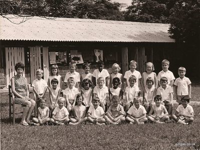 Changi Infants 1968
Thanks to Perry Gamsby for this photo.  Perry said "I am third from the left, back row. I think the teacher was Miss Vaughan.  The father of the black girl in the middle row was a RAF medic, he set my broken nose for me, did a super job. One of the girls is Penelope Duff-Dixon, remember the name but that is all."
Keywords: Changi Infants;1968;Perry Gamsby;Miss Vaughan;Penelope Duff-Dixon