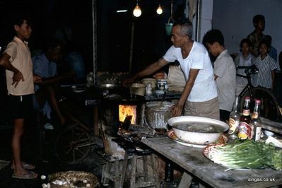 Fast Food stall on Orchard Road Singapore 1967
Fast Food stall on Orchard Road Singapore 1967
Keywords: Frank Clewes;1967;Orchard Road;Food stall