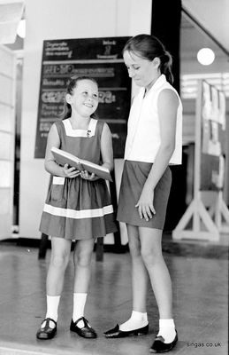 The lady who made up school uniforms
The lady who made up school uniforms asked me to take this picture for her advertisement in the school magazine. The two 'models' are Sharon Whatley aged 8, and Linda Kelly. There's my famous bulletin blackboard in the background . . .
Keywords: Bill Johnston;Wessex Junior;Pasir Panjang Junior;School;Sharon Whatley;Linda Kelly