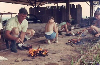 Hill 152
Hill 152 was in the NE of the island; an old saw mill was situated there and was a favourite place for the "Mansions" Cubs, Brownies, Guides and Scouts to go.  Here we are learning to cook.  (I am in the green shirt).
Keywords: Hill 152;Cubs;Brownies;Guides;Scouts