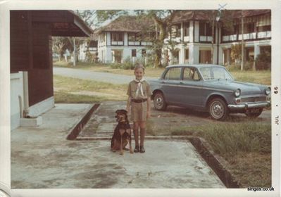 48 Hobart Road shows me in my cub uniform
48 Hobart Road shows me in my cub uniform with dadâ€™s Hillman Minx (Robert Blyth) and our house 68 Falkland Road in the background. The dog was Nobby. We adopted him when someone left Singapore to go back to the UK.
Keywords: Hobart Road;Hillman Minx;Falkland Road;Robert Blyth