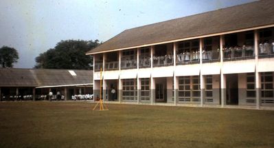 In the afternoons the school became a Malay school
In the afternoons the school became a Malay school for the children of Malay soldiers in the British army. They used all the classrooms and you can just make out the girls in their ankle-length blue 'cassocks' with long white 'surpilces' over them.
Keywords: Bill Johnston;Wessex Junior;Pasir Panjang Junior;School;Malay school