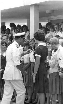 Visit by Prince Philip the Duke of Edinburgh to St. John's in February 1965.
Lindy Siegert said that

"The Duke was taken with the very large camera being held by Lorna Ironmonger and stepped forward to ask her about it."

"I know because I was standing next to her - somewhat obscure by the girl prefect and the blonde boy - but that is me in the cardigan."
Keywords: St. John&#039;St. Johns;Prince Philip;1965;Duke of Edinburgh;Lindy Siebert;Lorna Ironmonger