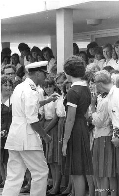 Visit by Prince Philip the Duke of Edinburgh to St. John's in February 1965.
Lindy Siegert said that

"The Duke was taken with the very large camera being held by Lorna Ironmonger and stepped forward to ask her about it."

"I know because I was standing next to her - somewhat obscure by the girl prefect and the blonde boy - but that is me in the cardigan."
Keywords: St. John&#039;St. Johns;Prince Philip;1965;Duke of Edinburgh;Lindy Siebert;Lorna Ironmonger