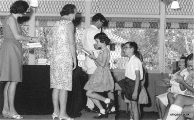 Susan Dodds at Annual Prize Giving.
Susan Dodds at Annual Prize Giving.  Being presented by Miss/Mrs Rantzen/Ransome?
Keywords: RN School;Susan Dodds