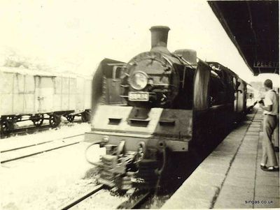 Gemas
Branch train arriving at Gemas from the east coast, tall lad on the right is probably Geoff Cox, as it certainly isn't Mick Ellison or Ian Hughes
Keywords: Lou Watkins;Gemas;Geoff Cox;Ian Hughes;Mick Ellison;train;Loco