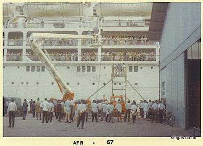 Oronsay
A familiar site to many of us waving farewell to friends & loved ones at the quayside in Singapore Docks ("Godown 44" rings a bell as the jetty for liners, anybody remember?)  This is the Oronsay in March/April 1967, which was en-route from New Zealand to the U.K.  I cannot remember why there was a film crew on the dockside.
Keywords: Lou Watkins;Oronsay;1967;Godown 44