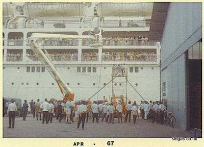 Oronsay
A familiar site to many of us waving farewell to friends & loved ones at the quayside in Singapore Docks ("Godown 44" rings a bell as the jetty for liners, anybody remember?)  This is the Oronsay in March/April 1967, which was en-route from New Zealand to the U.K.  I cannot remember why there was a film crew on the dockside.
Keywords: Lou Watkins;Oronsay;1967;Godown 44