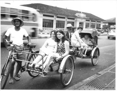 Singapore Saturday Trishaw from Collyer Quay
Singapore Saturday Trishaw from Collyer Quay.

Front Trishaw: Barb Zeller and Linda Whitman
 behind Trishaw: Bev Crush and Babs Lloyd.
Keywords: St. Johns;1968;Barb Zeller;Linda Whitman;Bev Crush;Babs Lloyd