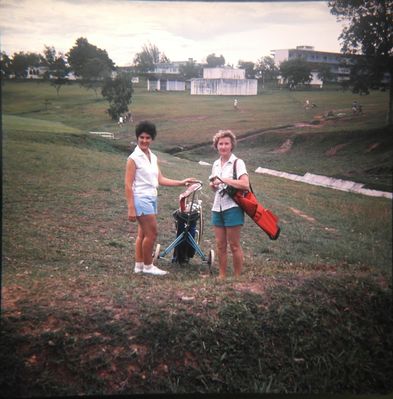 RAF Tengah Tour 1961-1964.
Mum on the golf course with red bag.
