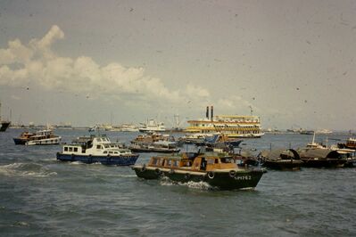 Singapore Lady
Paddle steamer in background  - Singapore Lady
