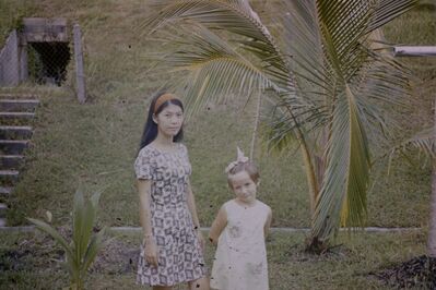 Our amah Sue in the back garden 1968
Sue was our amah in Dahan Road for 1968-1970. Look at the tunnel behind us. I was not allowed to explore it but think it was linked to WW2 as there were also the remains of buildings in the area in front of our house.
