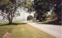1988-Upper_Changi_Road_looking_south_towards_the_crossing_of_the_airfield_apron-Airfield_on_the_left.jpg