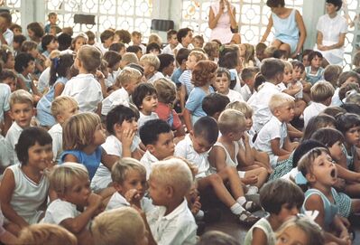 My sister Gill Moffett at Tengah Primary School when she about 7 years old. She is sitting next to the blonde girl with a blue top looking very intense. Looks like her whole year is present at assembly.
Keywords: Gillian Moffett;1967;Tengeh;Primary school