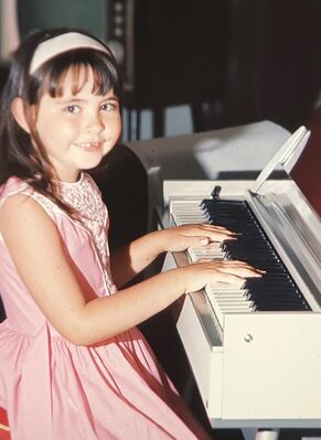 My sister Gill Moffett playing her new piano
Keywords: Gillian Moffett; Piano