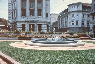 Dave Moffett and Gill Moffett sitting by a fountain outside The Mercantile Bank in Raffles Place
Keywords: David Moffett; Gillian Moffett; Raffles Place; Mercantile Bank; 1966; Fountains